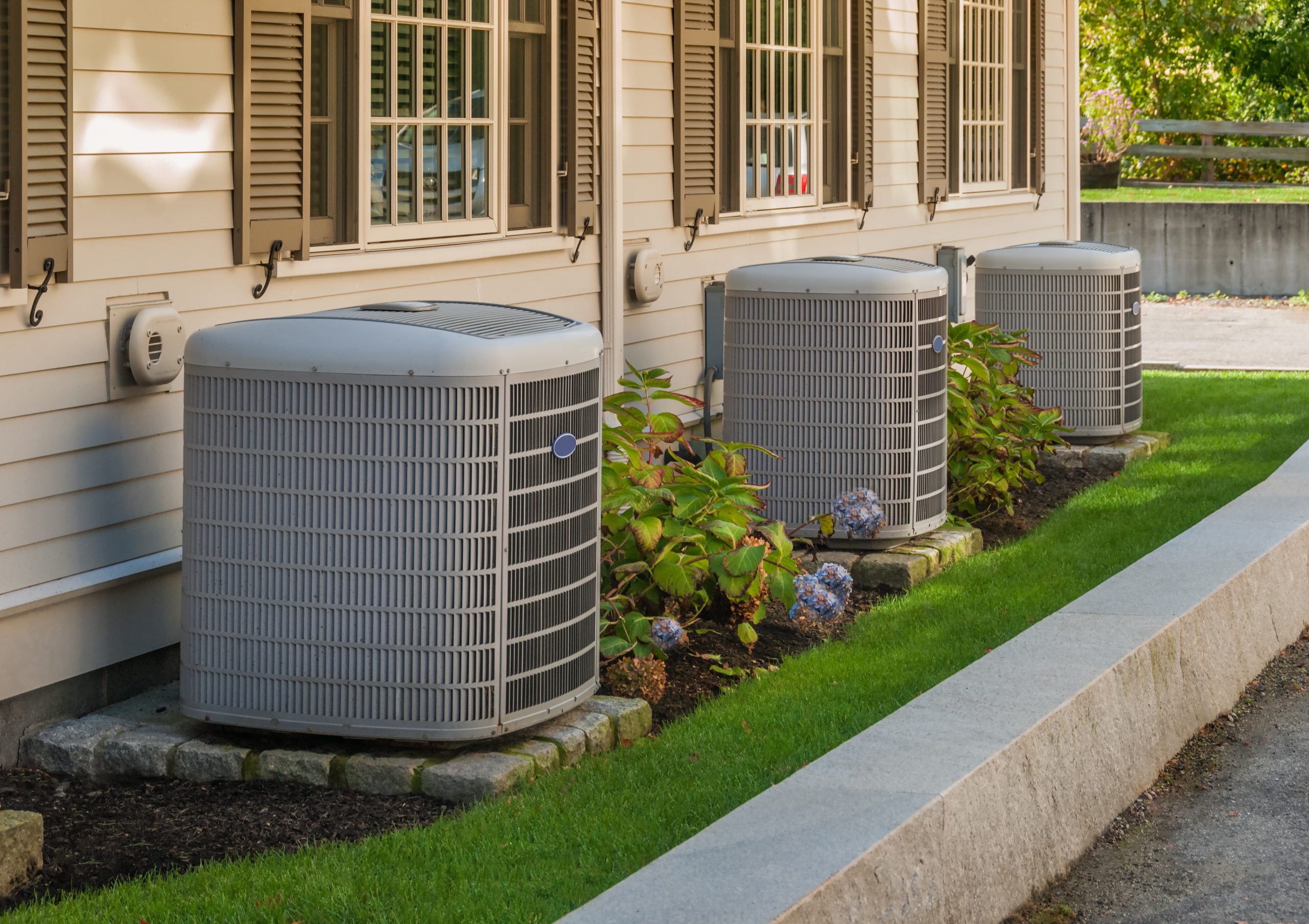 row of backyard air conditioning units require top hvac contractor